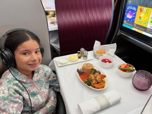 Here's our kiddo enjoying her meal on board Qatar airways short haul first class.